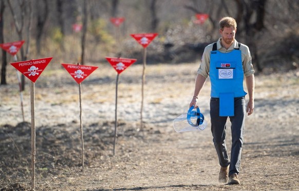 DIRICO, ANGOLA - SEPTEMBER 27: Prince Harry, Duke of Sussex walks through a minefield during a visit to see the work of landmine clearance charity the Halo Trust, on day five of the royal tour of Afri ...