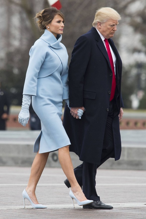 July 5, 2012 - Washington, DC, UNITED STATES - President Donald Trump and First Lady Melania Trump walk back to the Capitol Building after former President Barack Obama departed the inauguration, on C ...