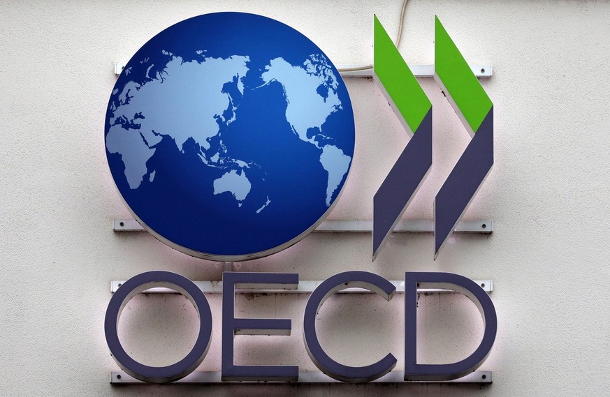 epa08005447 The logo of the OECD (Organisation for Economic Co-operation and Development) is seen during the launch of a new report by the OECD in Berlin, Germany, 18 November 2019. The report &#039;N ...
