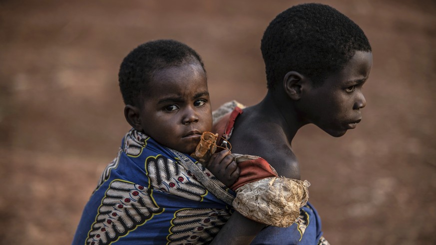 People displaced by conflict wait for the arrival of United Nations Under-Secretary-General for Peace Operations Jean Pierre Lacroix in Bunia, eastern Congo, Tuesday, Feb. 22, 2022. Lacroix replaced U ...