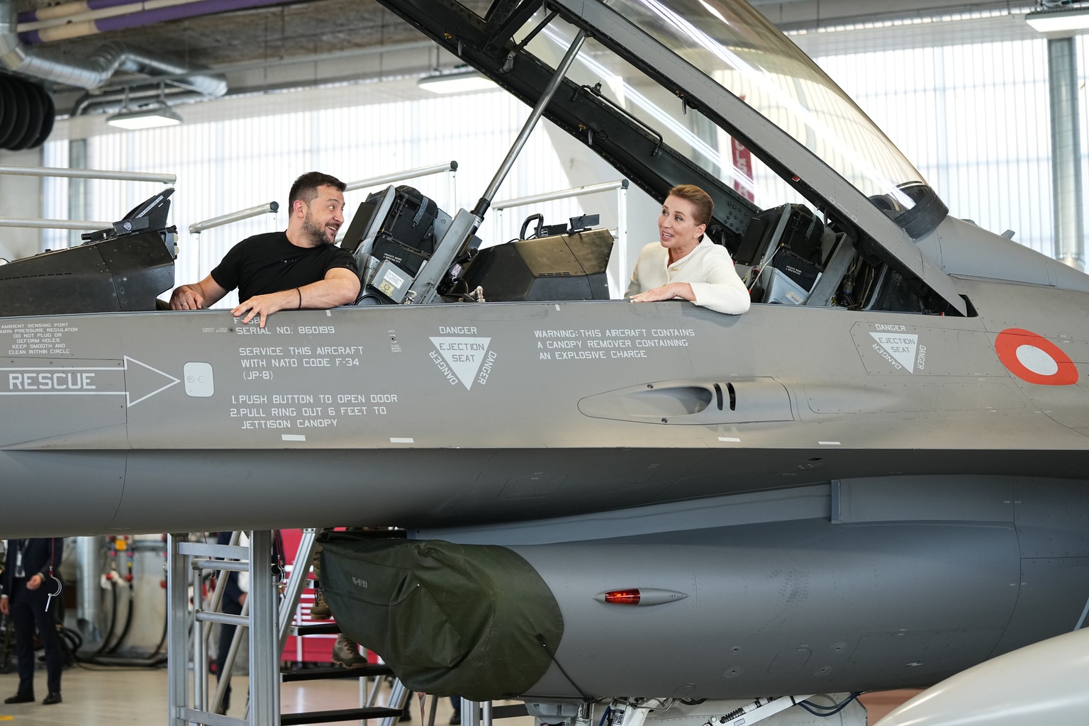 epa10810161 Ukrainian President Volodymyr Zelensky and Denmark&#039;s Prime Minister Mette Frederiksen sit in a F-16 fighter jet at Skrydstrup Airbase in Vojens, Denmark, 20 August 2023. The US State  ...
