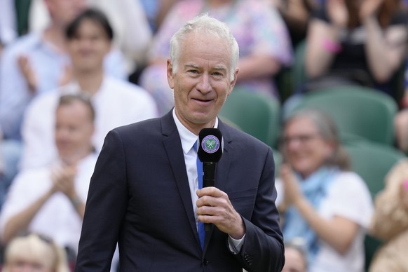 Former tennis player John McEnroe speaks during a100 years of Centre Court celebration on day seven of the Wimbledon tennis championships in London, Sunday, July 3, 2022. (AP Photo/Kirsty Wigglesworth ...