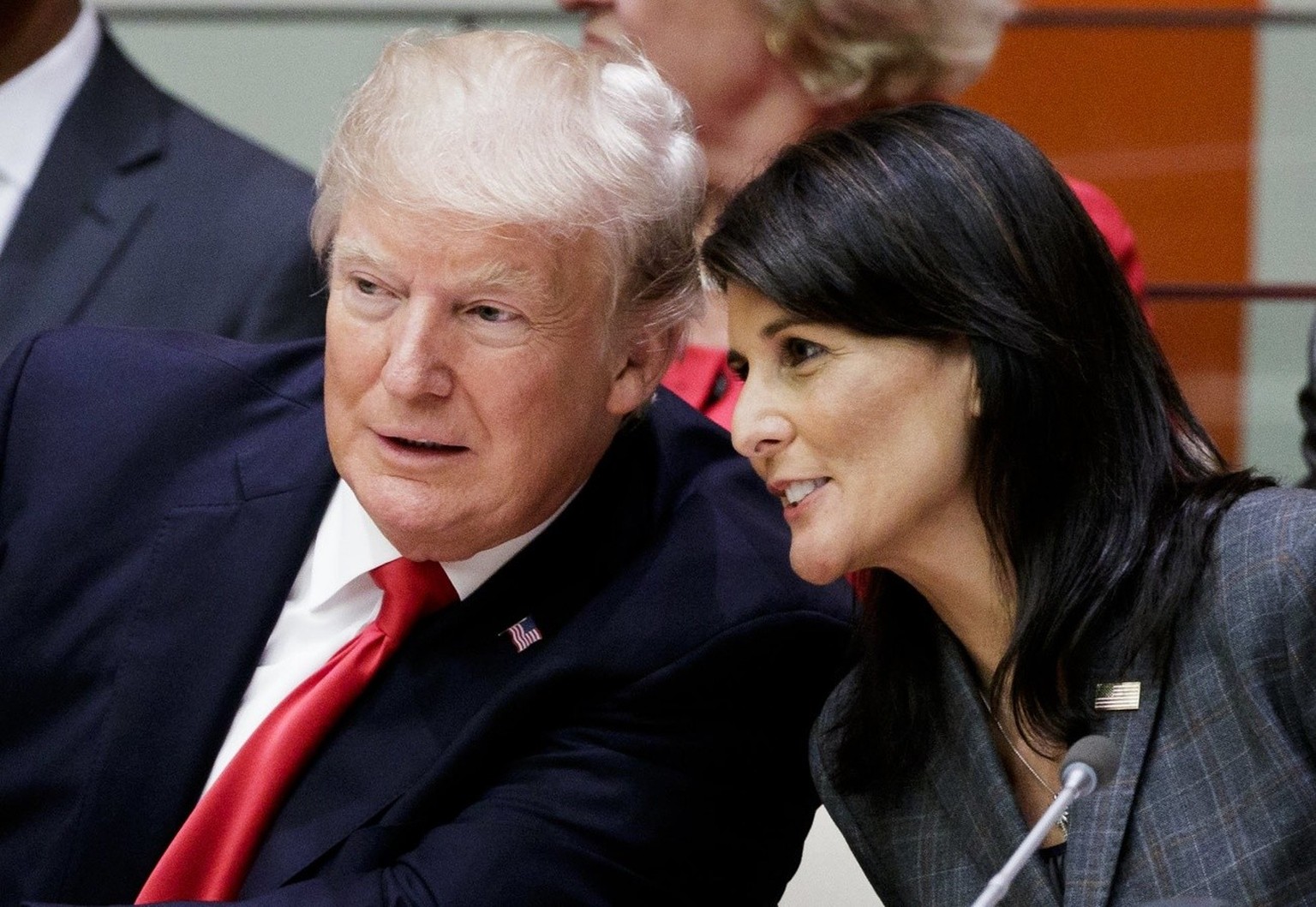 epa06212421 US President Donald J. Trump (L) and US Ambassador to the United Nations Nikki Haley (R) talk at the start of a meeting about reforming the United Nations the day before the opening of the ...