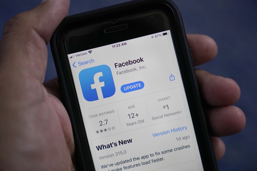 FILE - The Facebook app is shown on a smart phone in Surfside, Fla., Friday, April 23, 2021. Meta Platforms said Thursday, July 28, 2022, it will no longer pay U.S. news organizations to have their ma ...