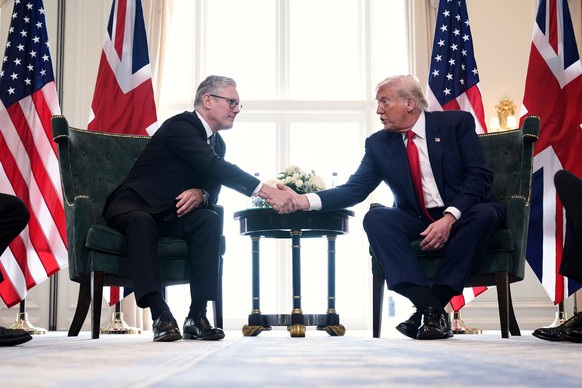 FILE - President Donald Trump, right, shakes hands with Britain's Prime Minister Keir Starmer during a meeting at the Trump Turnberry golf course in Turnberry, Scotland Monday, July 28, 2025. (AP ...