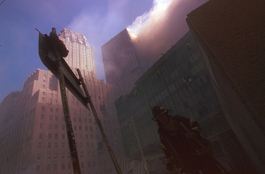 Colour photograph of a New York Fire-fighter amid the rubble of the World Trade Centre following the 9/11 attacks. Dated 2001. (Photo by: Universal History Archive/Universal Images Group via Getty Ima ...