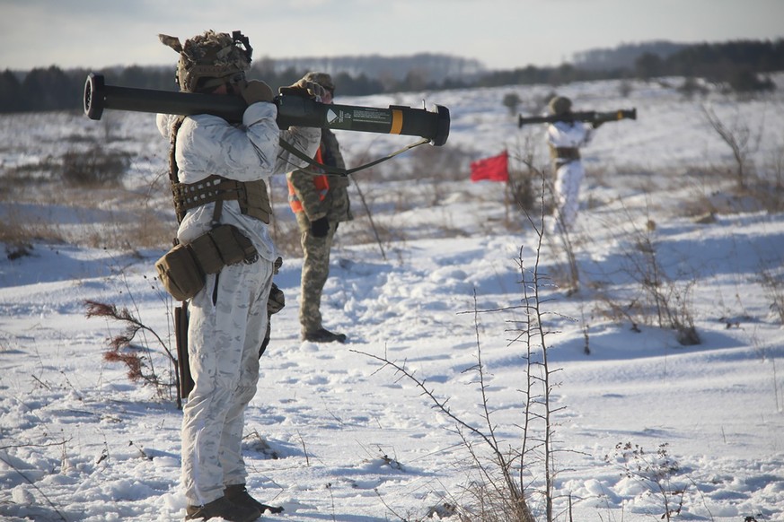 In this photo provided by the Ukrainian Defense Press Service and taken on Jan. 30, 2022, a Ukrainian soldier trains using the US M141 Bunker Defeat Munition (SMAW-D) missiles at the Yavoriv military  ...
