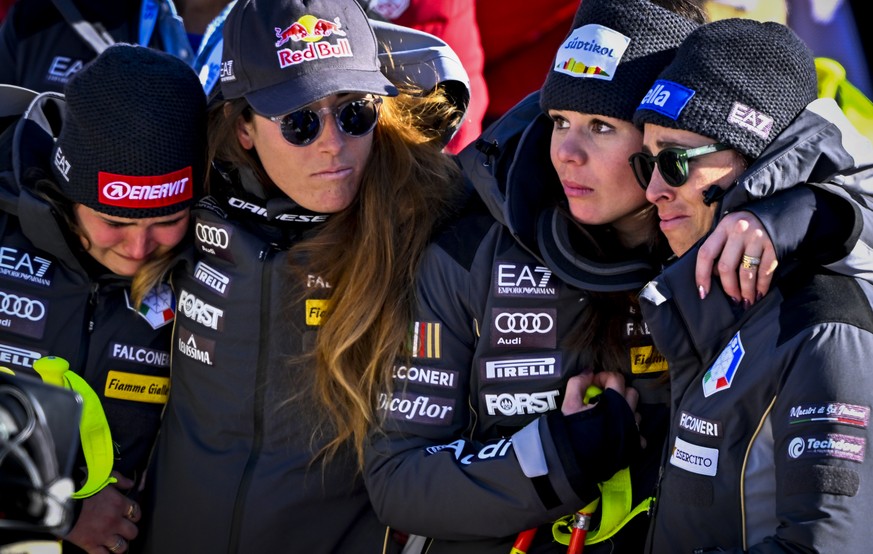 Skiers Laura Pirovano, Sofia Goggia, Nicol Delago Elena Curtoni of Italy, from left to right, pay tribute to Elena Fanchini in the finish area during the women&#039;s downhill race at the 2023 FIS Alp ...