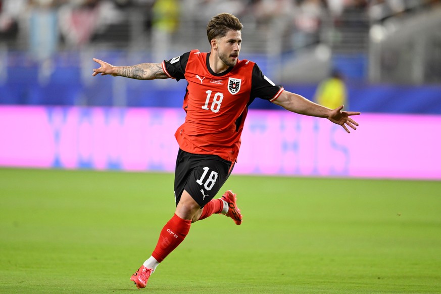 Austria's Romano Schmid (18) celebrates after scoring their opening goal during the World Cup Group J soccer match between Austria and Jordan in Santa Clara, Calif., near San Francisco, Tuesday,  ...
