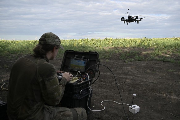 Drone pilot with callsign Rubik, 22, from the Reconnaissance Company &quot;Only Wars&quot; of the Ukrainian 3rd Army Corps controls a FPV drone during a training flight in an undisclosed location, in  ...