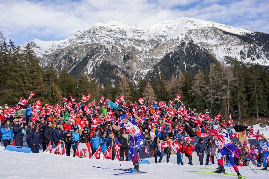 LENZERHEIDE, SWITZERLAND - FEBRUARY 12: Julia Simon of France wins gold medal, Jessica Jislova of Czechia wins silver medal, Selina Grotian of Germany wins bronze medal during the Mixed Relay of the I ...