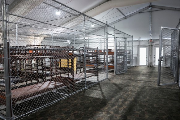 U.S. President Donald Trump, Florida Governor Ron DeSantis and U.S. Homeland Security Secretary Kristi Noem visit a temporary migrant detention center informally known as &quot;Alligator Alcatraz&quot ...