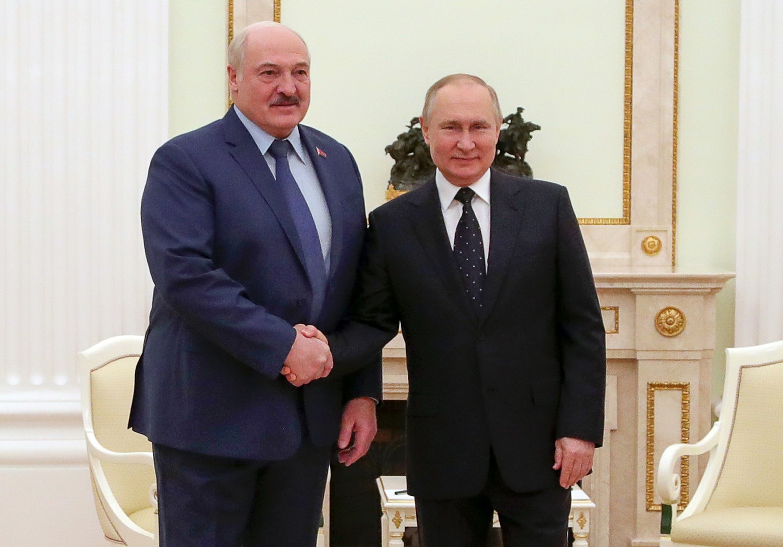 Russian President Vladimir Putin, right, and Belarusian President Alexander Lukashenko pose for a photo during their meeting in Moscow, Russia, Friday, March 11, 2022. (Mikhail Klimentyev, Sputnik, Kr ...
