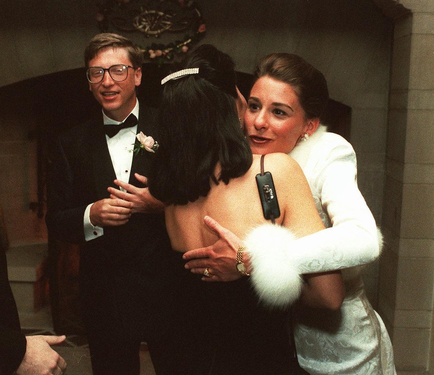 FILE - In this Jan. 9, 1994, file photo, computer mogul Bill Gates III and bride Melinda French greet guests in a reception line at a private estate in Seattle. The couple was married in Hawaii the we ...