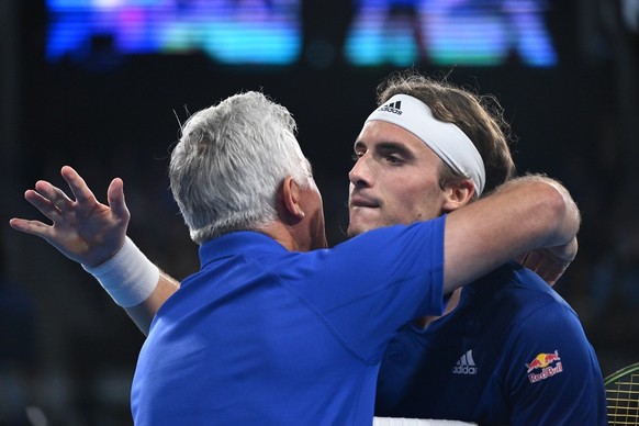 epa10393625 Stefanos Tsitsipas of Greece hugs his father after defeating Matteo Berrettini of Italy during the 2023 United Cup Semi-Final tennis match between Greece and Italy at Ken Rosewall Arena in ...