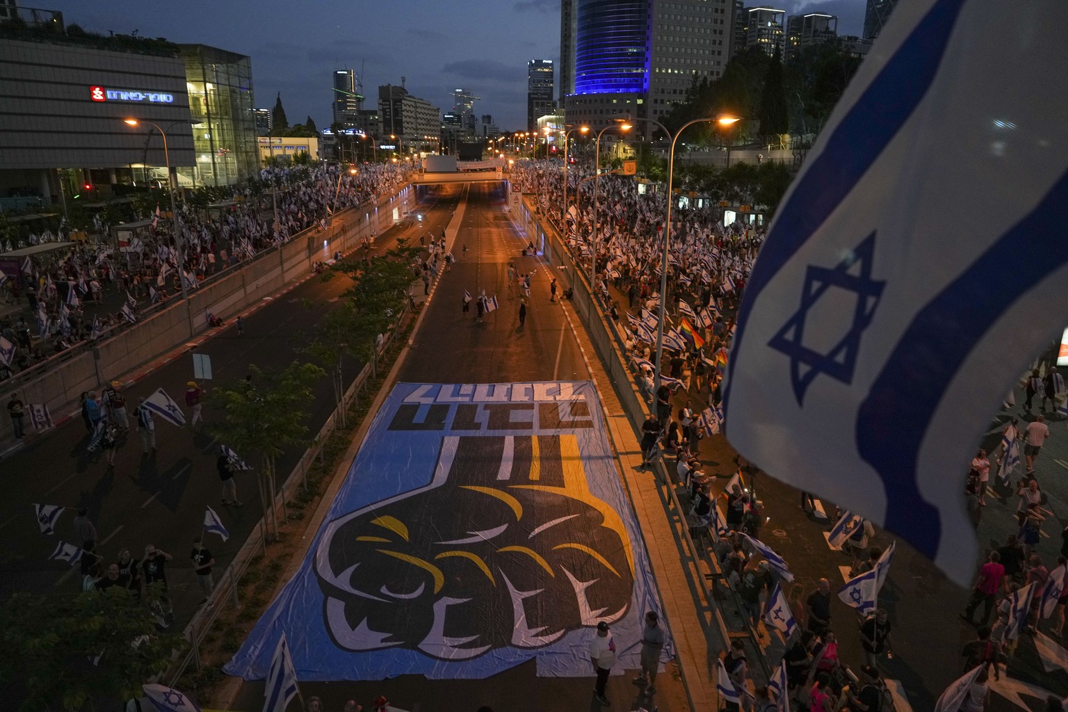Israelis protest against plans by Prime Minister Benjamin Netanyahu&#039;s government to overhaul the judicial system in Tel Aviv, Israel, Saturday, July 29, 2023. (AP Photo/Tsafrir Abayov)