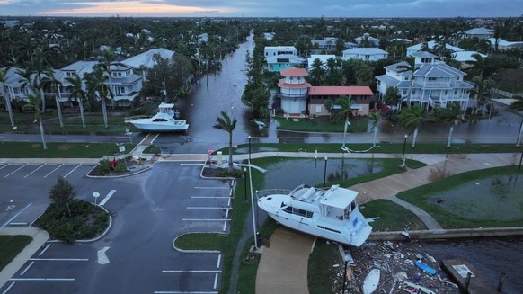 PUNTA GORDA - OCTOBER 10: In this aerial view, boats are washed ashore from when Hurricane Milton passed through the area on October 10, 2024, in Punta Gorda, Florida. The storm made landfall as a Cat ...
