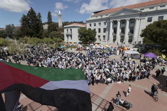 epa11303930 An Imam prayer leader gives a sermon in front of the student encampment at Sproul Hall on the University of California Berkeley campus in Berkeley, California, USA, 26 April 2024. The Pro- ...