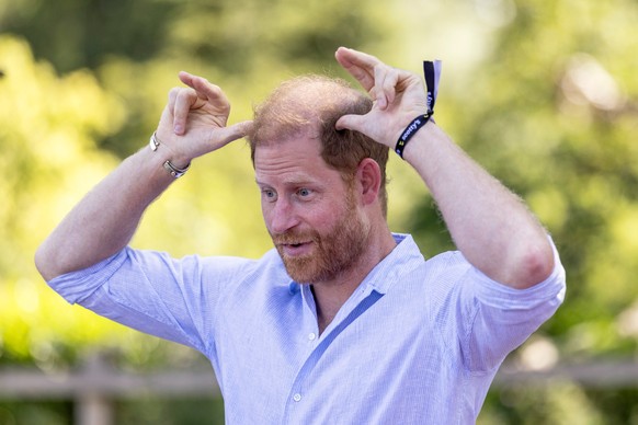 Britain's Prince Harry, the Duke of Sussex, Global Ambassador for Scotty's Little Soldiers, takes part in Goat yoga during a visit to Scotty's Summer Festival at Maxstoke Castle in Maxs ...