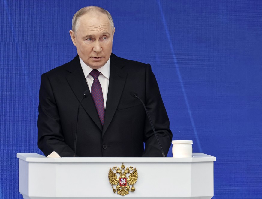 epa11188009 Russian President Vladimir Putin delivers his annual address to the Federal Assembly at the Gostiny Dvor conference center in Moscow, Russia, 29 February 2024. About 1,200 people, includin ...