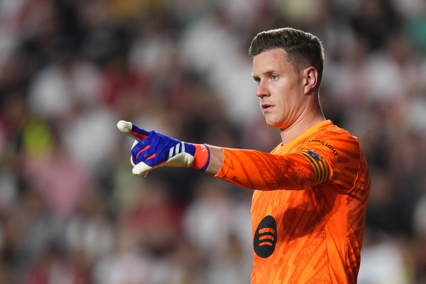 FILE - Barcelona&#039;s goalkeeper Marc-Andre ter Stegen gestures during the Spanish La Liga soccer match between Rayo Vallecano and Barcelona at the Vallecas stadium in Madrid, Spain, Aug. 27, 2024.  ...