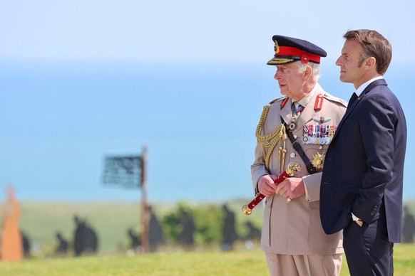 VER-SUR-MER, FRANCE - JUNE 06: King Charles III and President of France, Emmanuel Macron attend the UK Ministry of Defence and the Royal British Legion’s commemorative event at the British Normandy Me ...
