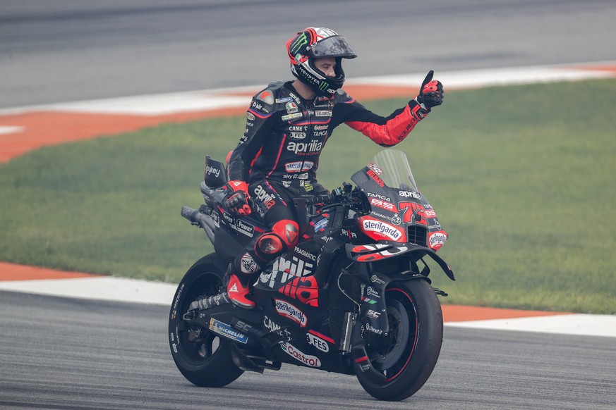 epa12529316 Aprilia Racing rider Marco Bezzecchi of Italy celebrates after winning the MotoGP race at the motorcyling Grand Prix of the Valencia Community at Ricardo Tormo track, in Cheste, Valencia,  ...