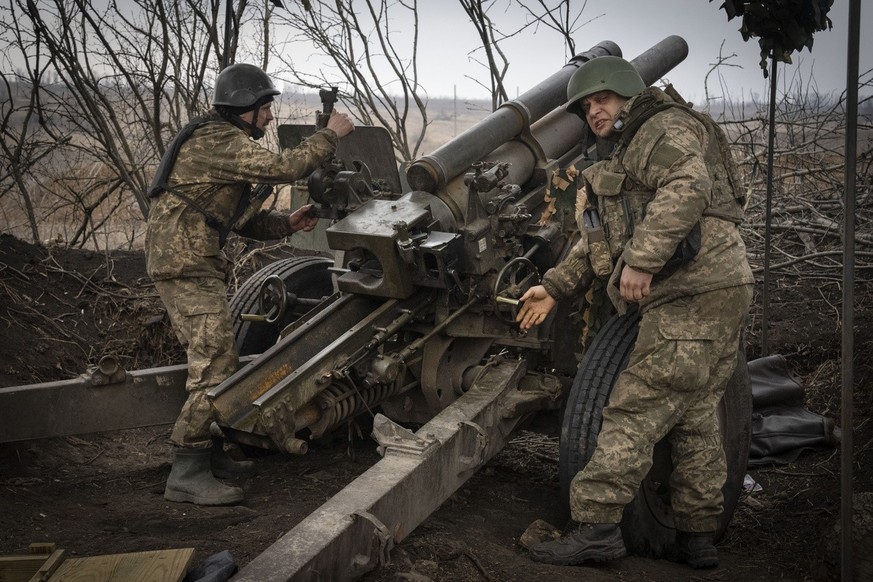 Ukrainian soldiers of the 71st Jaeger Brigade fire a M101 howitzer towards Russian positions at the frontline, near Avdiivka, Donetsk region, Ukraine, Friday, March 22, 2024. (AP Photo/Efrem Lukatsky)