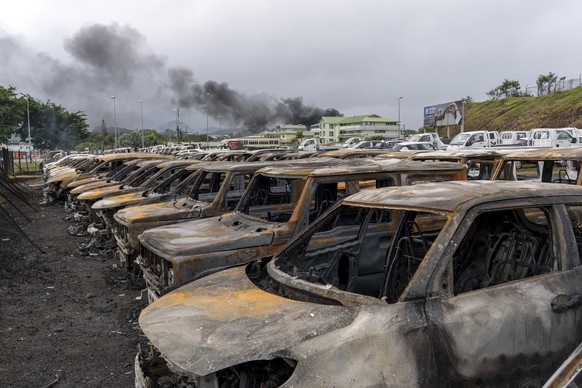 Burnt cars are lined up after unrest that erupted following protests over voting reforms in Noumea, New Caledonia, Wednesday, May 15, 2024. (AP Photo/Nicolas Job)