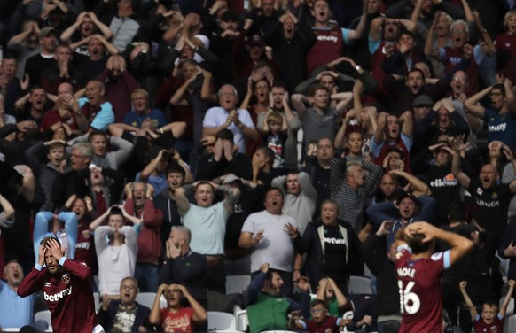 West Ham&#039;s Andriy Yarmolenko, left, reacts after missing a chance to score during the English Premier League soccer match between West Ham United and Chelsea at London Stadium in London, Sunday,  ...