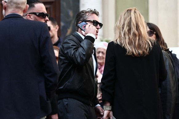 French TV host Benjamin Castaldi (C) leaves after attending the funeral ceremony of Loana Petrucciani, the first reality TV star in France, at the cathedral of Sainte-Reparate in Nice, southeastern Fr ...