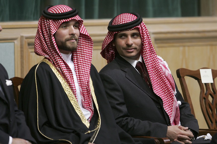 File - In this Tuesday, Nov. 28, 2006 file photo, Prince Hamza Bin Al-Hussein, right, and Prince Hashem Bin Al-Hussein, left, brothers King Abdullah II of Jordan, attend the opening of the parliament  ...