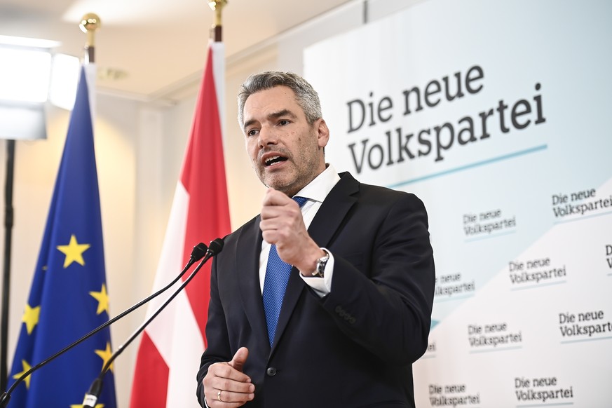 epa09618627 Austrian Interior Minister Karl Nehammer, new leader of the Austrian Peoples Party?s (OeVP) party and new designated Austrian Chancellor, speaks during a press conference following an OeVP ...