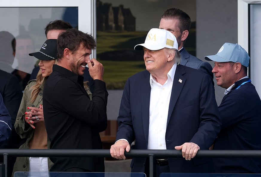 CLARECASTLE, IRELAND - SEPTEMBER 12: Brooks Koepka of the United States speaks with U.S. President Donald Trump on day three of the Amgen Irish Open at Trump International Golf Links in Doonbeg on Sep ...