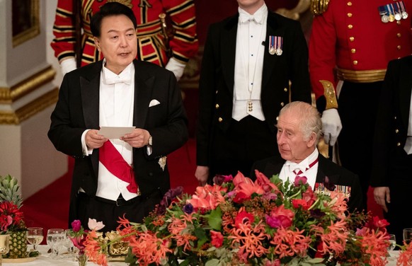 South Korean President state visit to the UK President of South Korea Yoon Suk Yeol listens as King Charles III speaks at the state banquet at Buckingham Palace, London, for the state visit to the UK  ...