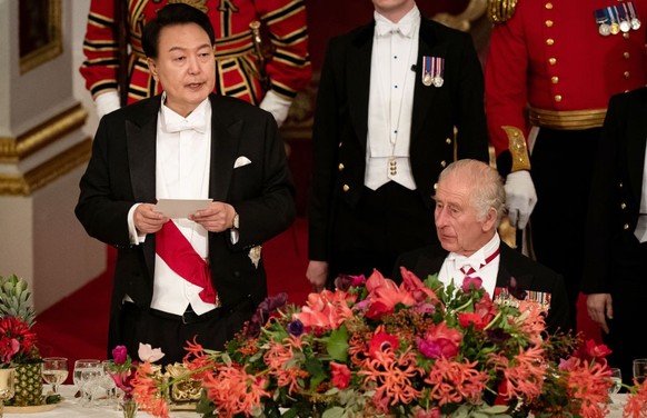 South Korean President state visit to the UK President of South Korea Yoon Suk Yeol listens as King Charles III speaks at the state banquet at Buckingham Palace, London, for the state visit to the UK ...