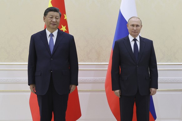 Chinese President Xi Jinping, left, and Russian President Vladimir Putin pose for a photo on the sidelines of the Shanghai Cooperation Organisation (SCO) summit in Samarkand, Uzbekistan, Thursday, Sep ...