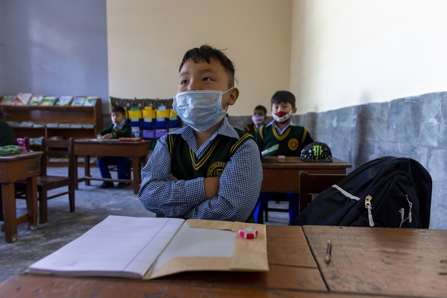 Exile Tibetan children wearing masks to curb the spread of the coronavirus attend a class at the Tibetan Children&#039;s Village Day School in Dharmsala, India, Tuesday, March 2, 2021. The school open ...