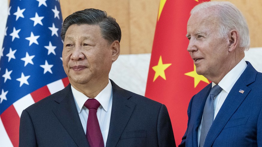 FILE - U.S. President Joe Biden, right, stands with Chinese President Xi Jinping before a meeting on the sidelines of the G20 summit meeting on Nov. 14, 2022, in Bali, Indonesia. Xi accused Washington ...