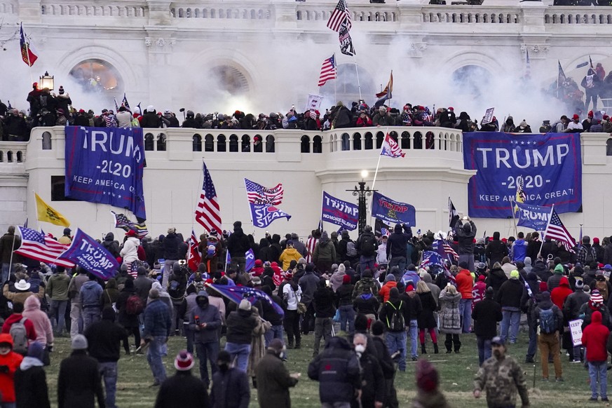 FILE - In this Jan. 6, 2021 file photo rioters supporting President Donald Trump storm the Capitol in Washington. An Army reservist charged with taking part in the attack on the U.S. Capitol was known ...
