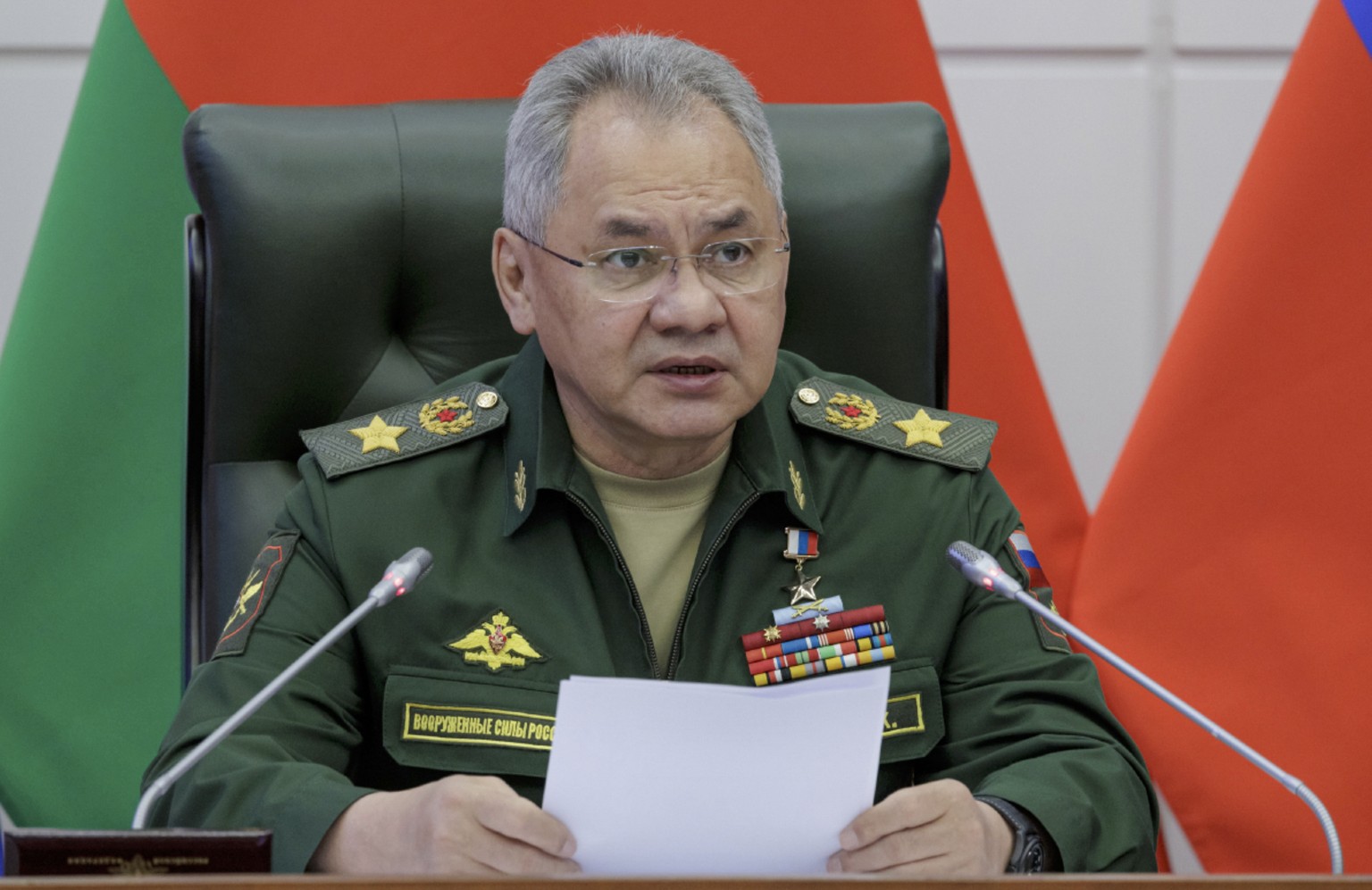 epa10925940 A handout picture provided by the Russian Defence ministry press-service shows Russian Defence Minister Sergei Shoigu delivers his speech during meeting of the joint Board of the Ministrie ...