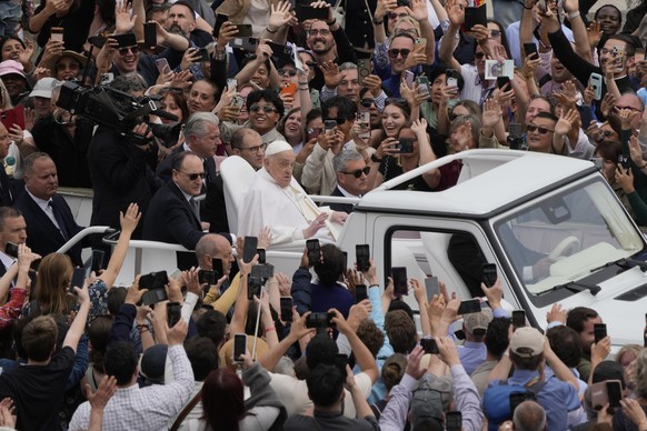 Pope Francis tours St. Peter&#039;s Square in his popemobile after bestowing the Urbi et Orbi (Latin for to the city and to the world) blessing at the end of the Easter mass presided over by Cardinal  ...