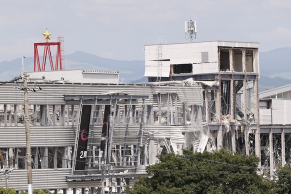 epa13140935 A view of the Aeon Mall Kumamoto building which was damaged by an explosion following a powerful earthquake in Kashima, Kumamoto Prefecture, southwestern Japan, 30 July 2026. Rescue operat ...