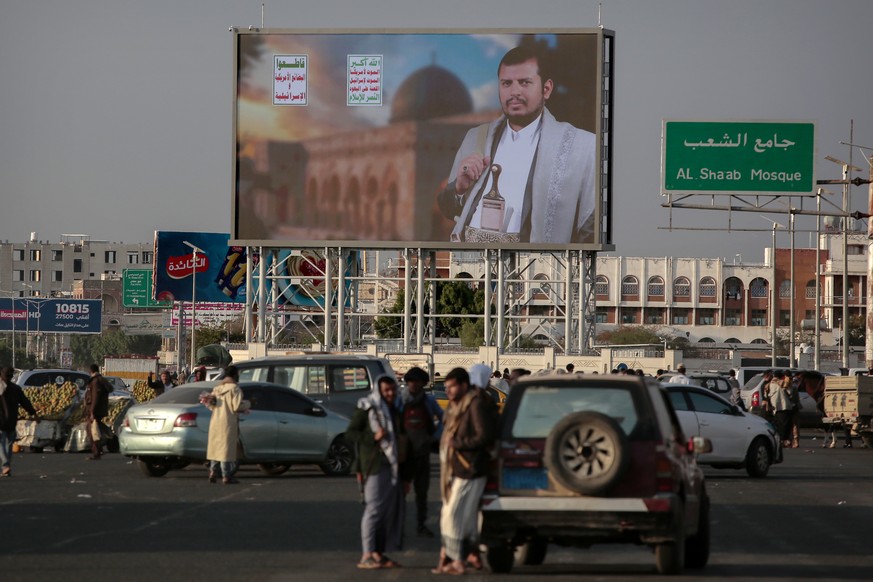 Yemenis stand under a street billboard displaying a picture of Abdul Malik al-Houthi, the leader of the Houthi movement, in Sanaa, Yemen, Tuesday, March 18, 2025. (AP Photo/Osamah Abdulrahman)
Yemen I ...
