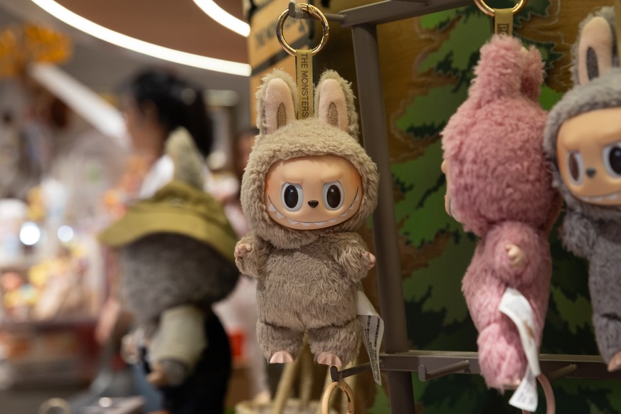 epa12180684 Labubu dolls are displayed at a Pop Mart store in Beijing, China, 17 June 2025. Labubu is a Nordic-inspired character and collectible plush toy designed by Hong Kong designer Kasing Lung.  ...
