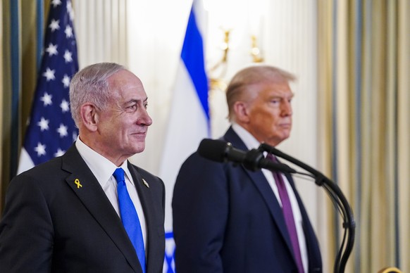 epa12415342 US President Donald Trump (R) and Israeli Prime Minister Benjamin Netanyahu (L) participate in a joint press conference in the State Dining Room of the White House in Washington, DC, USA,  ...