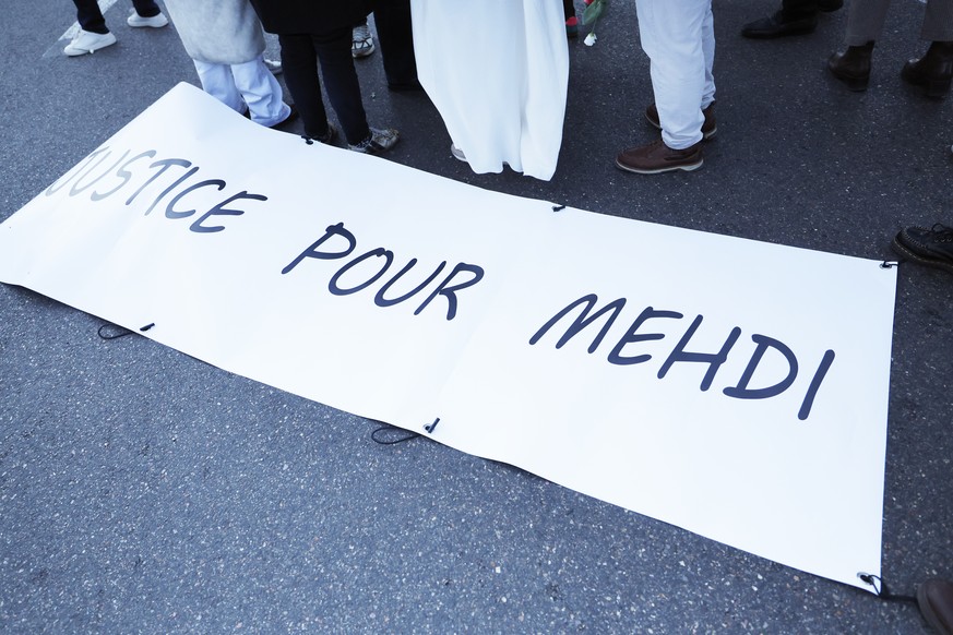 epa12541870 A banner reading Justice for Mehdi is held during a silent march in memory of Mehdi Kessaci, the brother of anti-drug trafficking activist Amine Kessaci, in Marseille, France, 22 Novembe ...