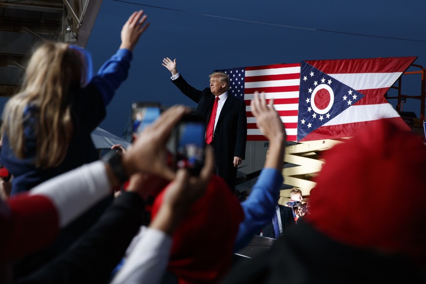 FILE- In this Oct. 12, 2018 file photo then President Donald Trump waves as he arrives for a campaign rally, in Lebanon, Ohio. A GOP-backed bill introduced Monday, April 20, 2021, would change the nam ...