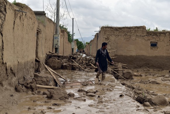 An Afghan man walks near his damaged home after heavy flooding in Baghlan province in northern Afghanistan Saturday, May 11, 2024. Flash floods from seasonal rains in Baghlan province in northern Afgh ...