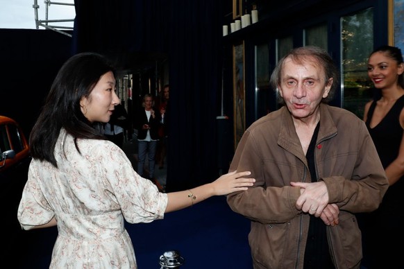 PARIS, FRANCE - JUNE 19: Writer Michel Houellebecq and his wife Qianyum Lysis Li attend the Laperouse Mask Ball on the occasion of the inauguration evening of the Laperouse Restaurant ; as part of Par ...